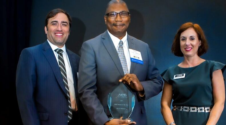 Norcross Mayor Craig Newton receives the Partner of the Year Award on behalf of the city from the non-profit Access to Capital for Entrepreneurs. (Courtesy City of Norcross)