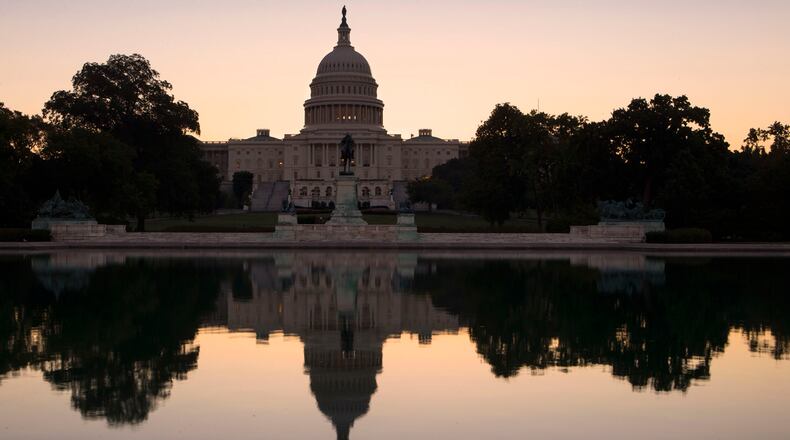 The U.S. Capitol is seen as the political stare-down in Congress shows no signs of easing, in Washington, Wednesday, Oct. 2, 2013. A funding cutoff for much of the government began Tuesday as a Republican effort to kill or delay the nation's health care law stalled action on a short-term, traditionally routine spending bill. Lawmakers in both parties have ominously suggested the partial shutdown might last for weeks. (AP Photo/J. Scott Applewhite)
