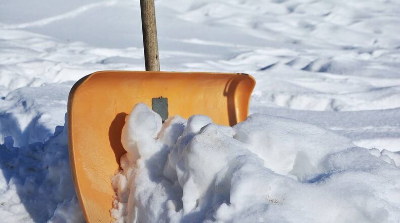 An Arizona man shoveling snow was buried up to his waist when snow fell off the roof of a cabin.