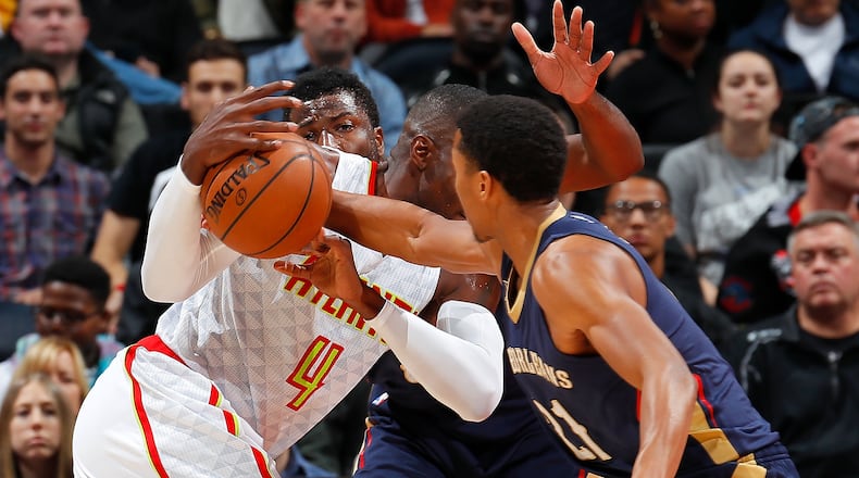 ATLANTA, GA - NOVEMBER 22: Solomon Hill #44 of the New Orleans Pelicans defends as Anthony Brown #21 steals the ball from Paul Millsap #4 of the Atlanta Hawks at Philips Arena on November 22, 2016 in Atlanta, Georgia. NOTE TO USER User expressly acknowledges and agrees that, by downloading and or using this photograph, user is consenting to the terms and conditions of the Getty Images License Agreement. (Photo by Kevin C. Cox/Getty Images)