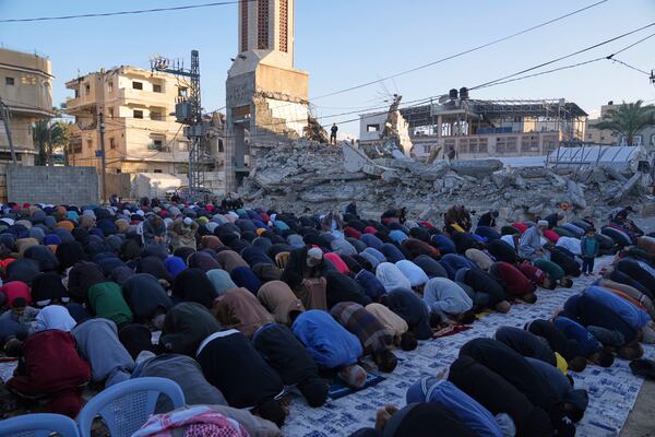 Palestinians attend Eid al-Fitr prayer in Deir al-Balah, Gaza Strip, Sunday, March 30, 2025. (AP Photo/Abdel Kareem Hana)