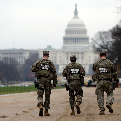 National Guard patrol along the National Mall in front of the Capitol, Wednesday, Nov. 26, 2025, in Washington. (AP Photo/Rahmat Gul)