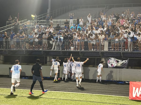 Atlanta International players celebrate their 1-0 2in over Whitefield Academy in the Class 1-3A Private soccer championship, May 14, 2025, at Duluth High School.