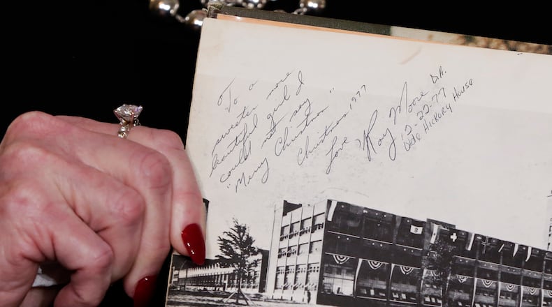 Beverly Young Nelson, the latest accuser of Alabama Republican Roy Moore, shows her high school yearbook signed by Moore, at a press conference in New York on Monday. Nelson says Moore assaulted her when she was 16 and he offered her a ride home from a restaurant where she worked. AP/Richard Drew