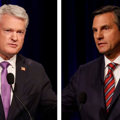 U.S. Rep Mike Collins (left) and former football coach Derek Dooley, both Republican candidates for the U.S. Senate, spoke at the Atlanta Press Club Loudermilk-Young debate last month. (Miguel Martinez/AJC)