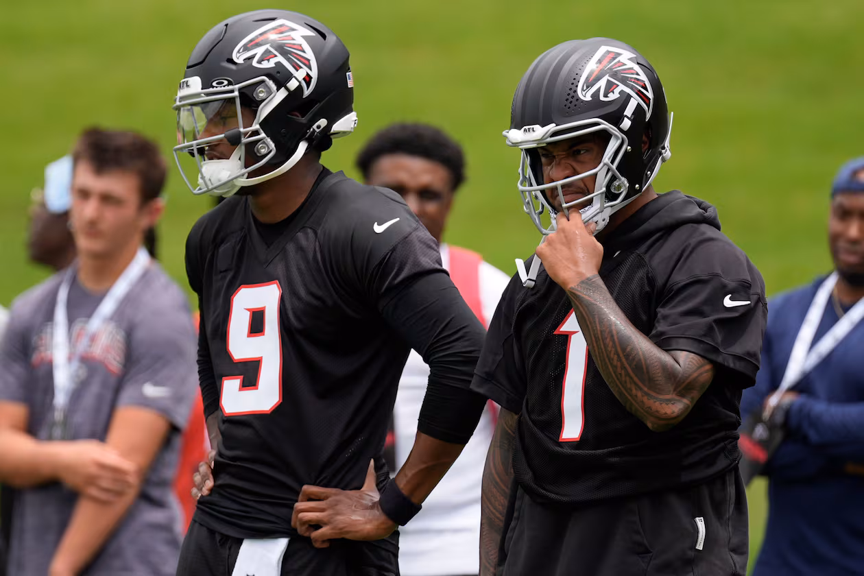 Falcons quarterbacks Michael Penix Jr. (left) and Tua Tagovailoa stand together at practice Wednesday, May 27, 2026, in Flowery Branch, Ga. (Mike Stewart/AP)