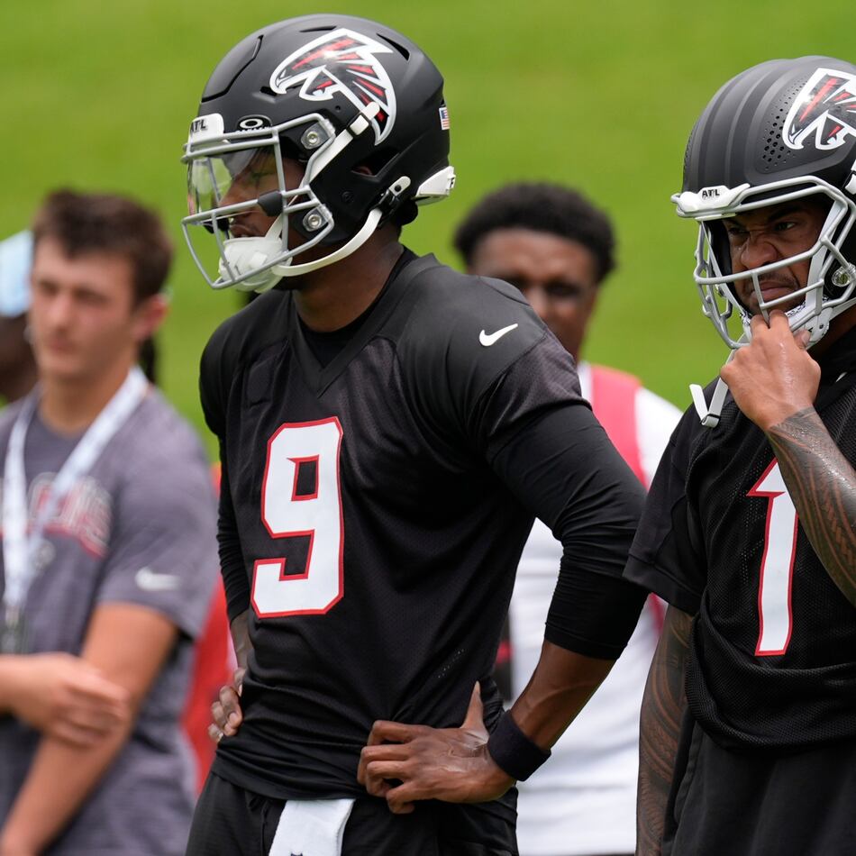 Falcons quarterbacks Michael Penix Jr. (left) and Tua Tagovailoa stand together at practice Wednesday, May 27, 2026, in Flowery Branch, Ga. (Mike Stewart/AP)
