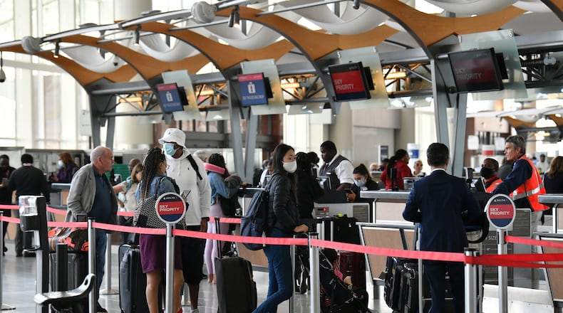 April 29, 2022 Atlanta - International travelers wait in line to checking-in at Delta Air Lines counter in Maynard H. Jackson Jr. International Terminal on Friday, April 29, 2022. (Hyosub Shin / Hyosub.Shin@ajc.com)