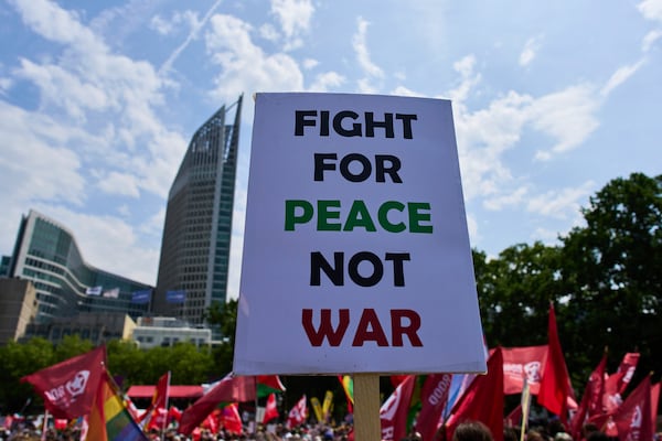 People attend a demonstration ahead of the NATO summit in The Hague, Netherlands, Sunday, June 22, 2025. (AP Photo/Peter Dejong)
