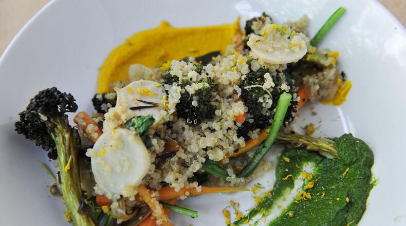 Grain Bowl with quinoa, baby Vidalia onions, turnip greens, roasted broccoli and carrots at Ration and Dram. (CONTRIBUTED BY BECKY STEIN)