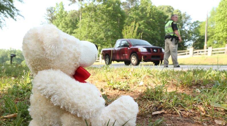 A teddy bear sits in memory of a girl, 16, killed Wednesday in a Henry County wreck.