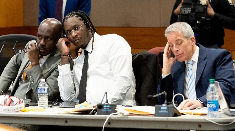 Atlanta rapper Young Thug listens in on a bench meeting between the judge and another attorney before the opening statements in his Fulton County gang and racketeering trial on Monday, Nov. 27, 2023. (Steve Schaefer/steve.schaefer@ajc.com)