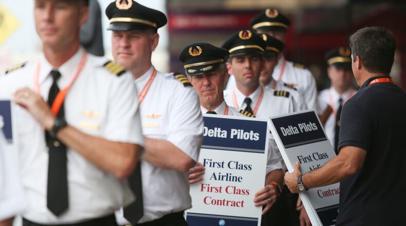 June 24, 2016 Atlanta: Delta pilots conduct informational picketing at the south terminal at Hartsfield-Jackson Atlanta International Airport on Friday morning. Delta pilots are raising awareness and urgency with Delta management for higher pay in negotiations for a new labor contract. "We are almost six months overdue for a new labor contract," said Master Executive Council (MEC) Chairman of Delta Airlines, John Malone, who has worked at Delta Airlines for 28 years. Delta pilots around the country also participated on Friday morning. EMILY JENKINS/ EJENKINS@AJC.COM