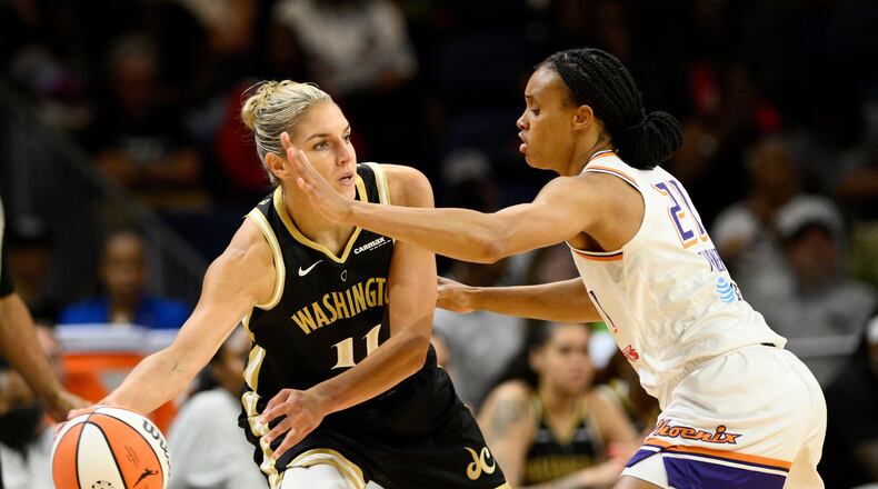 FILE - Washington Mystics forward Elena Delle Donne (11) looks to pass the ball as Phoenix Mercury forward Brianna Turner (21) defends during the first half of a WNBA basketball game, June 16, 2023, in Washington. (AP Photo/Nick Wass, File)