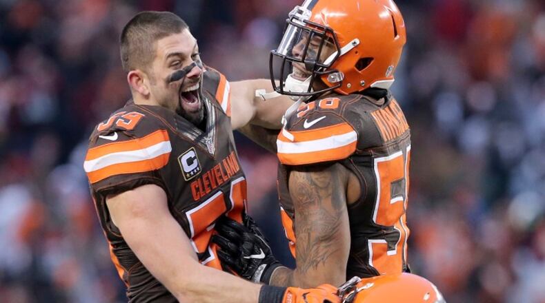 The Cleveland Browns' Tank Carder, left, and Christian Kirksey celebrate a 20-17 win against the San Diego Chargers on December 24, 2016, at FirstEnergy Stadium in Cleveland. (Phil Masturzo/Akron Beacon Journal/TNS)
