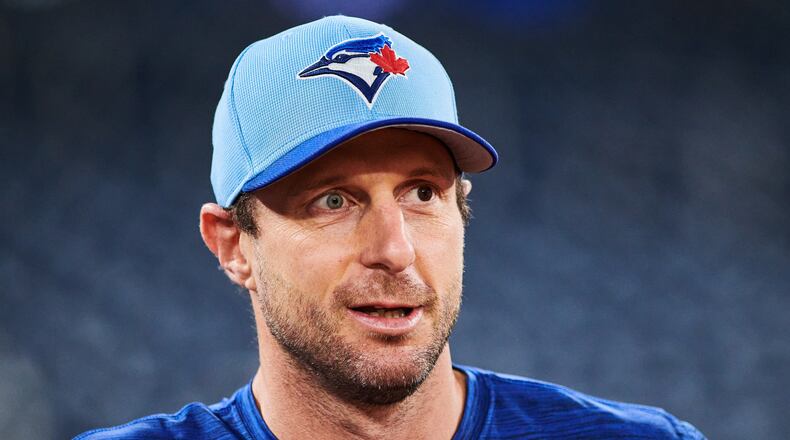 Toronto Blue Jays' Max Scherzer (31) looks on before batting practice Saturday, Oct. 18, 2025, in Toronto, ahead of Sunday's Game 6 in baseball's American League Championship Series against the Seattle Mariners. (Sammy Kogan/The Canadian Press via AP)