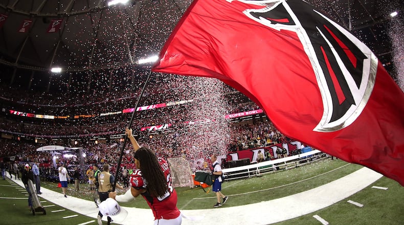 ATLANTA, GA - JANUARY 22: Jalen Collins #32 of the Atlanta Falcons celebrates with a Falcons flag after defeating the Green Bay Packers in the NFC Championship Game at the Georgia Dome on January 22, 2017 in Atlanta, Georgia. The Falcons defeated the Packers 44-21. (Photo by Tom Pennington/Getty Images)
