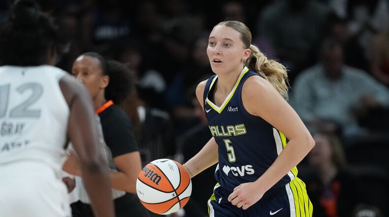 Dallas Wings guard Paige Bueckers (5) moves the ball up court against the Las Vegas Aces during the second half of a WNBA preseason basketball game in Austin, Texas, Sunday, May 3, 2026. (AP Photo/Eric Gay)