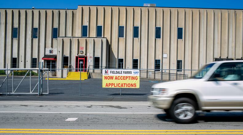 A sign advertising jobs at Fieldale Farms hangs outside of the company's corporate headquarters in Gainesville. The Trump administration is letting chicken slaughterhouses run faster. In recent years, according to federal safety records obtained by ProPublica, Fieldale Farms in Gainesville, Georgia, has been the site of several grisly accidents, resulting in hospitalizations, amputations and death. (Photo/Rebecca Wright for the Atlanta Journal-Constitution)