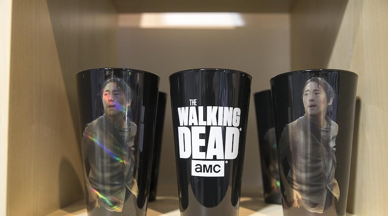 “The Walking Dead” fan gear is displayed at the Atlanta Movie Tour headquarters in the Castleberry Hills neighborhood in 2019. The writer of this Op-Ed says Georgia’s film tax credits are not nearly worth their considerable cost to the state. (Alyssa Pointer/alyssa.pointer@ajc.com)