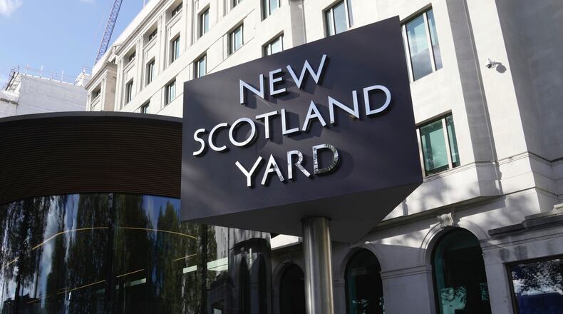 FILE - A sign stands in front of the New Scotland Yard, the headquarters of the London Metropolitan Police, in London, on Sept. 25, 2023. (AP Photo/Kin Cheung, File)