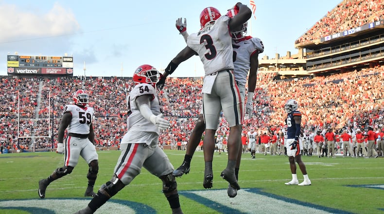 Georgia running back Zamir White (3) celebrates with teammates after scoring a touchdown during the second half against Auburn Saturday, Oct. 9, 2021, at Jordan-Hare Stadium in Auburn, Ala. Georgia won 34-10. (Hyosub Shin / Hyosub.Shin@ajc.com)