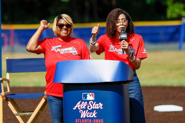 Libby Saylor Wright (right), CEO of Boys and Girls Club of Metro Atlanta, recognizes club Executive Director Terry Walker-Moore for her 25 years of service during the unveiling of the new All-Star Legacy Field at the Barksdale Boys & Girls Club in Conyers on Thursday, July 10, 2025. (Miguel Martinez/ AJC)