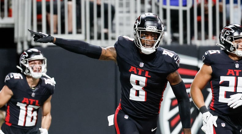 Atlanta Falcons tight end Kyle Pitts (8) reacts after scoring a touchdown during the first half of an NFL football game against the Tampa Bay Buccaneers on Sunday, Dec. 10, at Mercedes-Benz Stadium in Atlanta. 
Miguel Martinez/miguel.martinezjimenez@ajc.com