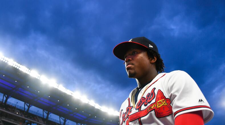 Atlanta Braves center fielder Ronald Acuna Jr. walks to the dugout before taking the field for a baseball game against the New York Mets, Wednesday, Aug. 14, 2019, in Atlanta. (AP Photo/John Amis)