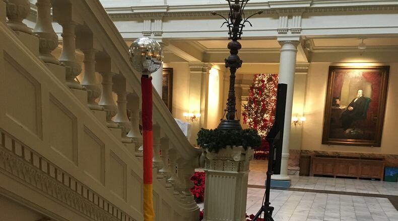 A Gay Pride Festivus Pole stands vigil in the Georgia Capitol