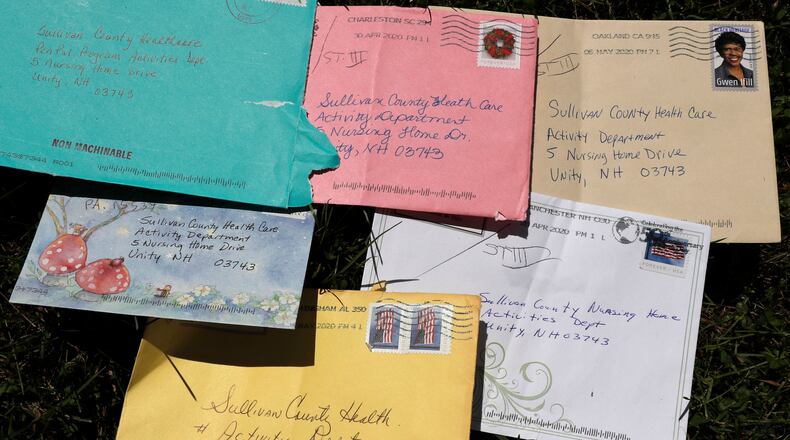 Pen pal letters are displayed outside the Sullivan County Health Care nursing home in Unity, N.H., June 8, 2020. (AP Photo/Charles Krupa, File)