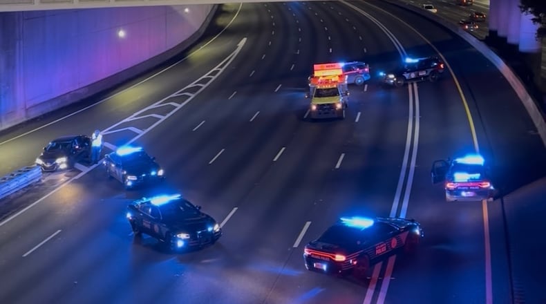 Atlanta police and a Georgia Department of Transportation HERO unit shut down I-75/I-85 North at Spring Street after a person was hit and killed early Thursday, Aug. 27, 2026. (Doug Turnbull for the AJC)
