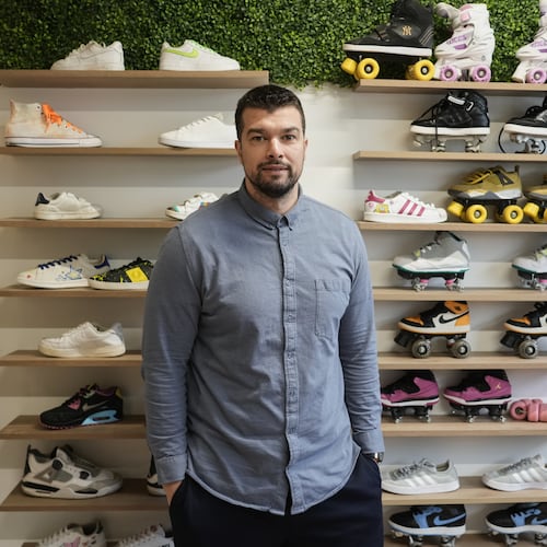 Mohamed Boukhatem, co-founder and director of SneakCoeurZ, a nonprofit organization giving used footwear a second life, poses in Champs-sur-Marne, east of Paris, Wednesday, March 25, 2026. (AP Photo/Thibault Camus)