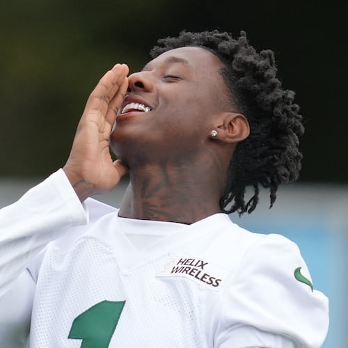 New York Jets cornerback Sauce Gardner (1), gestures during an NFL football practice at The Grove in Watford, England, Friday, Oct. 10, 2025. (AP Photo/Kin Cheung)