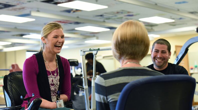 Aimee Copeland, left, works as a case management intern at Shepherd Center in this November 2015 file photo.