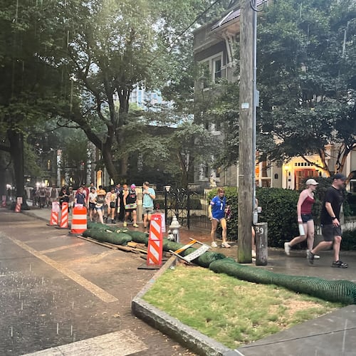 Festival goers leave Piedmont Park after Shaky Knees music festival was evacuated due to severe weather on Saturday, Sept. 19, 2026. (Lindsay Deutsch/AJC)