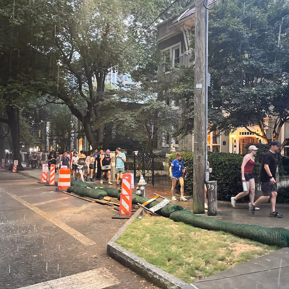 Festival goers leave Piedmont Park after Shaky Knees music festival was evacuated due to severe weather on Saturday, Sept. 19, 2026. (Lindsay Deutsch/AJC)