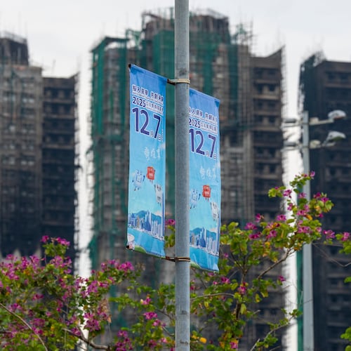 Banners promoting the Hong Kong Legislative Council General Election hang near the site of the fire at Wang Fuk Court in the Tai Po district of Hong Kong on Wednesday, Dec. 3, 2025. (AP Photo/Chan Long Hei)