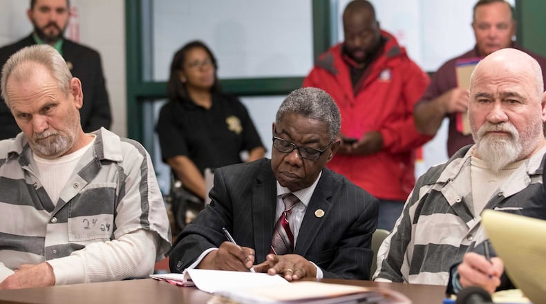 Frankie Gebhardt, second from right, and Bill Moore Sr., left, sat silently during a preliminary hearing in a courtroom located inside the Spalding County law enforcement complex, Thursday, November 30, 2017. The men are being accused of murdering Timothy Coggins in 1983. Coggins, who was 23-years-old when the murder occurred, was allegedly killed for socializing with a white woman.