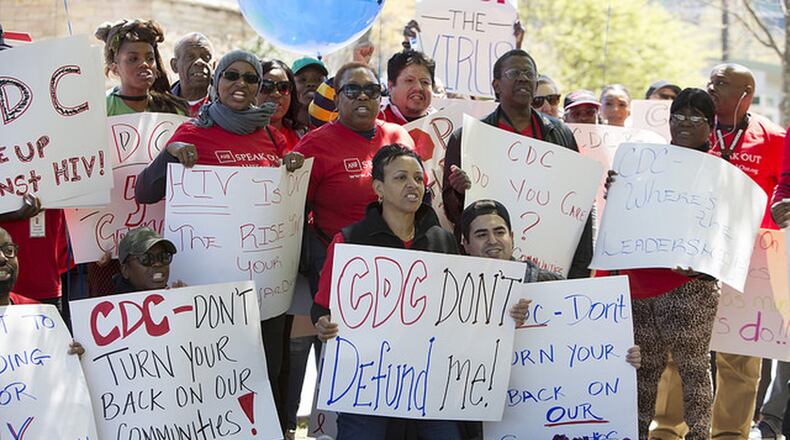 Nearly 100 AID Atlanta supporters turned out Friday to demand an answer from the Centers of Disease Control and Prevention about why the agency denied funding to the nonprofit. CONTRIBUTED