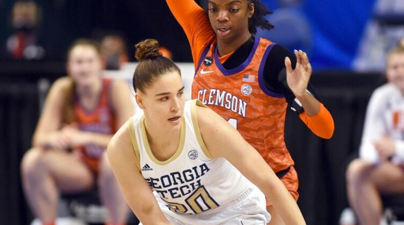 Georgia Tech's Nerea Hermosa is guarded by Clemson's Mikayla Hayes during an NCAA college basketball game in the quarterfinals of the Atlantic Coast Conference women's tournament Friday, March 5, 2021, in Greensboro, N.C. (Walt Unks/The Winston-Salem Journal via AP, Pool)