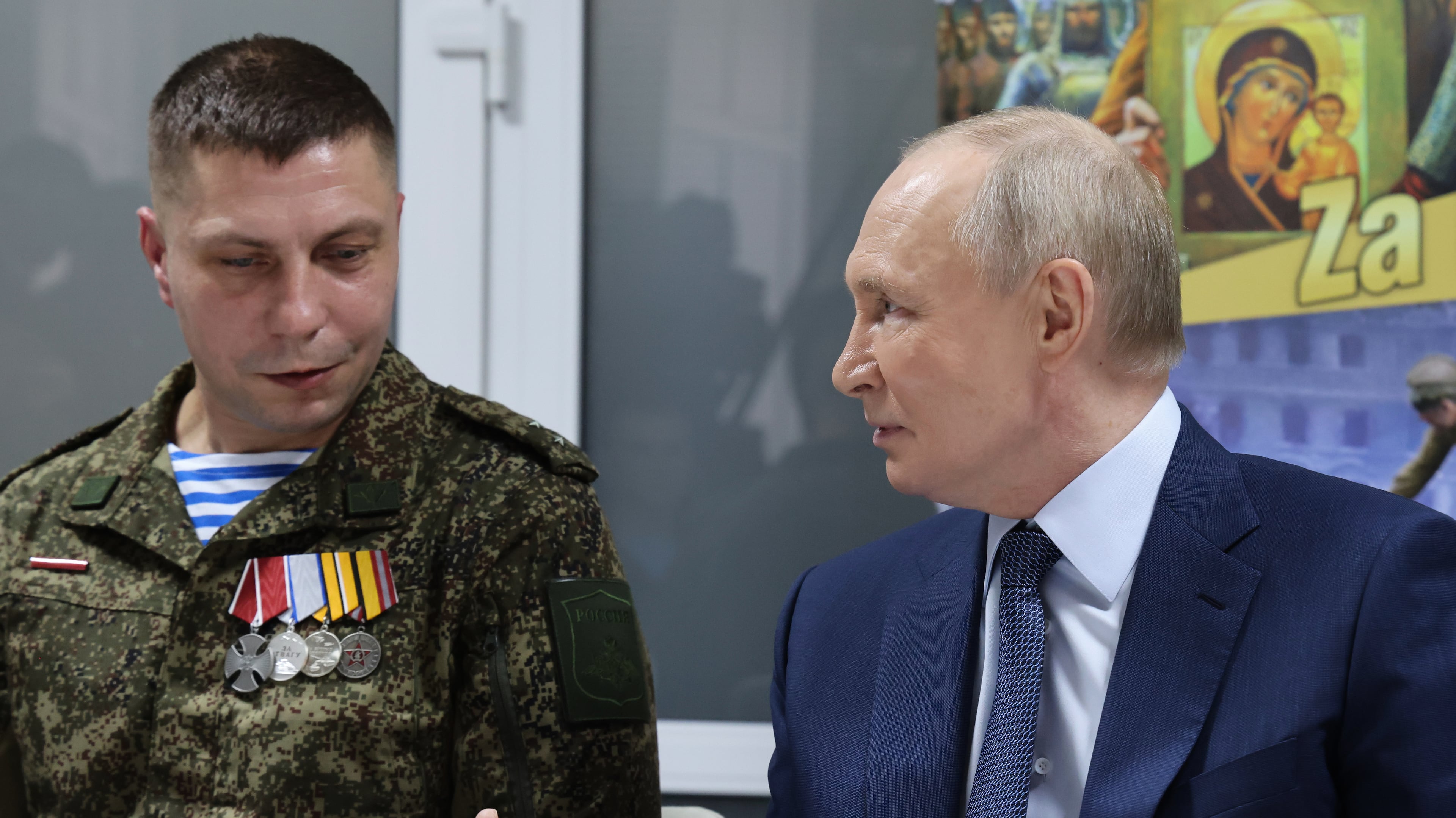 Russian President Vladimir Putin, right, talks with Russian servicemen who fought in Ukraine as he visits the Central Military Clinical Hospital, in Moscow, Russia, Wednesday, Oct. 29, 2025. (Vladimir Gerdo, Sputnik, Kremlin Pool Photo via AP)
