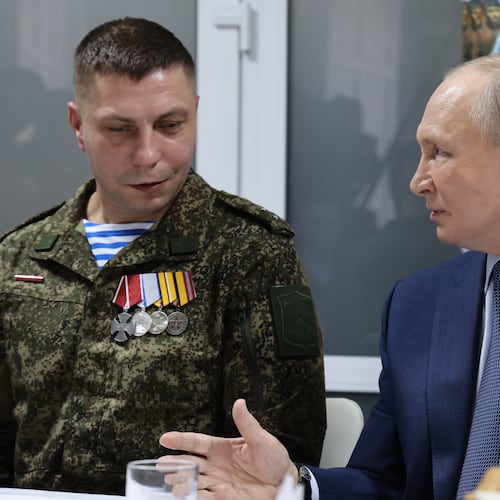 Russian President Vladimir Putin, right, talks with Russian servicemen who fought in Ukraine as he visits the Central Military Clinical Hospital, in Moscow, Russia, Wednesday, Oct. 29, 2025. (Vladimir Gerdo, Sputnik, Kremlin Pool Photo via AP)