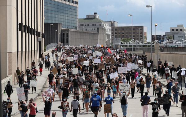 May 29, 2020 — Atlanta — After a peaceful march the Georgia State Capitol that swelled into the hundreds, protestors returned to the area around the Centennial Olympic Park and CNN center where some confronted police, who sprayed some demonstrators with pepper spray. They carried signs and chanted their messages of outrage over the death of George Floyd in Minneapolis. ALYSSA POINTER / ALYSSA.POINTER@AJC.COM