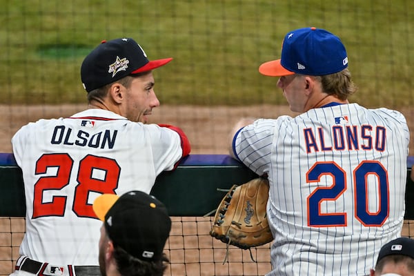 Braves first baseman Matt Olson (left) speaks with National League teammate Pete Alonso of the New York Mets during the MLB All-Star Game at Truist Park on Tuesday, July 15, 2025, in Atlanta. (Hyosub Shin/AJC)