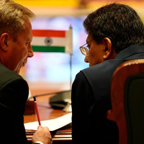New Zealand Trade Minister Todd McClay, left, talks with Indian Commerce Minister Piyush Goyal during the India New Zealand Free Trade Agreement signing ceremony and Business forum meeting in New Delhi, India, Monday, April 27, 2026. ( AP Photo/Manish Swarup)