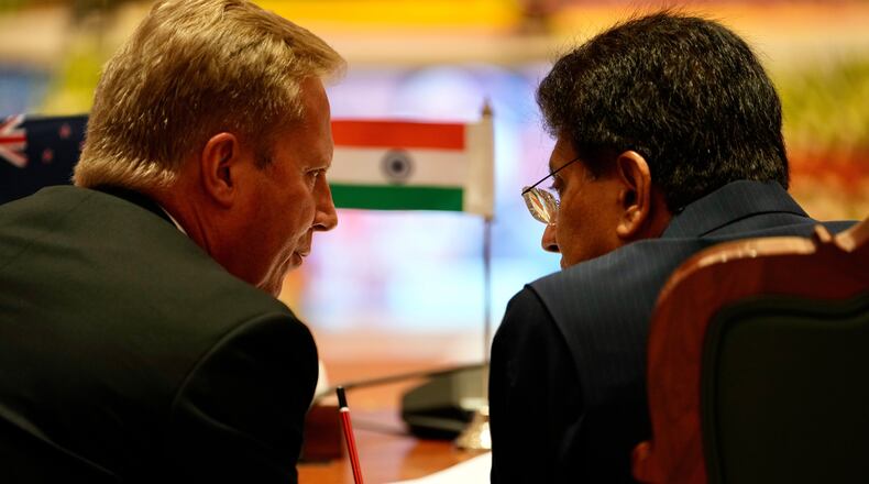 New Zealand Trade Minister Todd McClay, left, talks with Indian Commerce Minister Piyush Goyal during the India New Zealand Free Trade Agreement signing ceremony and Business forum meeting in New Delhi, India, Monday, April 27, 2026. ( AP Photo/Manish Swarup)
