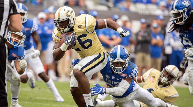 Georgia Tech running back Dedrick Mills (26) is tackled by Kentucky safety Mike Edwards (27) during the TaxSlayer Bowl in Jacksonville, Fla., on Dec. 31, 2016. (AP Photo/Stephen B. Morton, File)