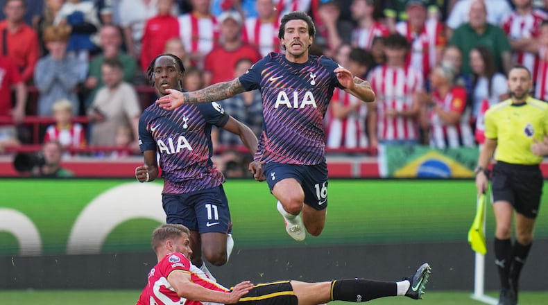 Brentford's Kristoffer Ajer, bottom, and Tottenham's Sandro Tonali in action during the English Premier League soccer match between Brentford and Tottenham Hotspur in London, Saturday, Aug. 22, 2026. (AP Photo/Kin Cheung)