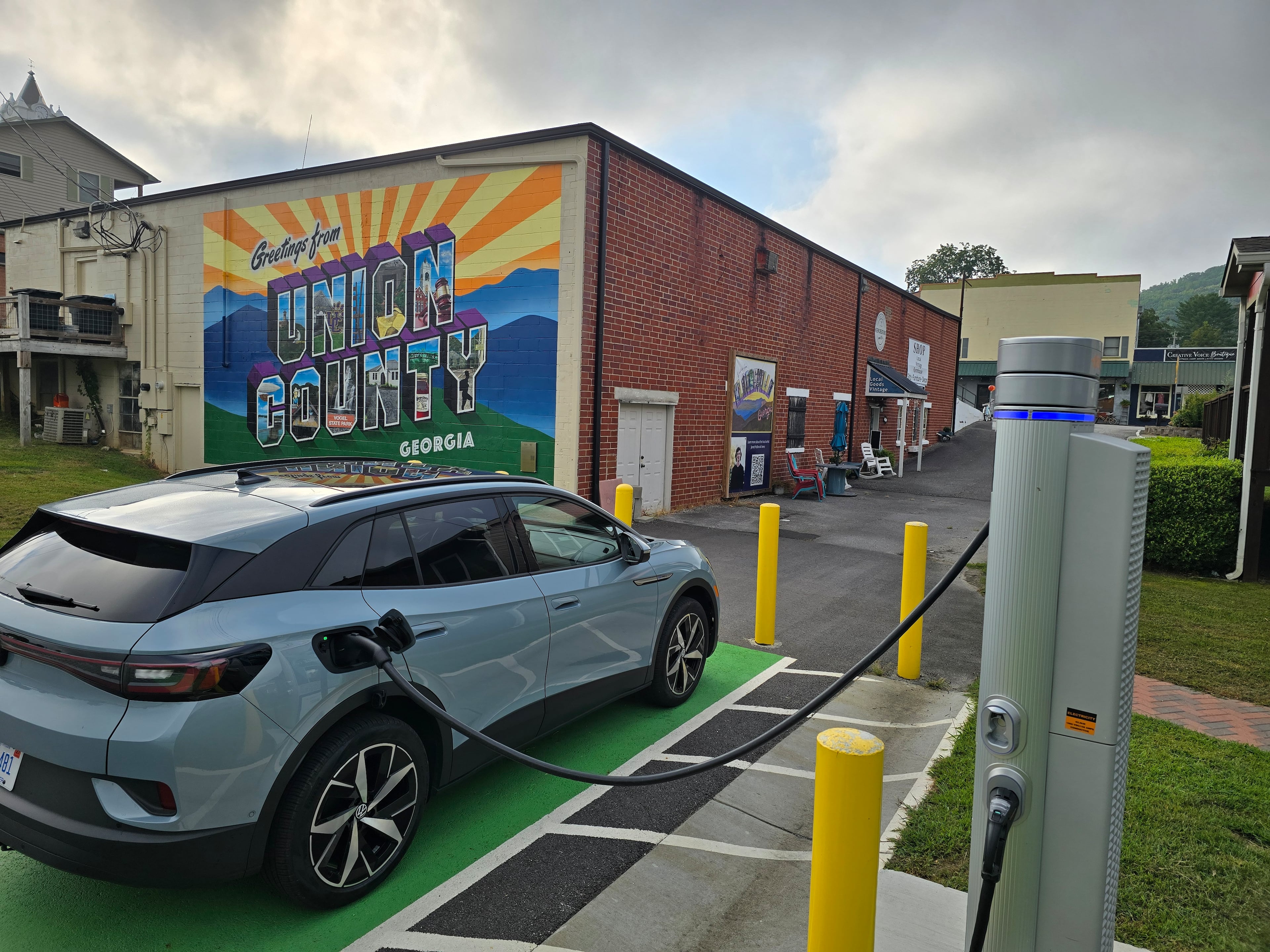 A Volkswagen ID.4 electric car using a public charging station in the municipal parking lot in Blairsville, Ga., Sept. 7, 2024. (Credit: Chris Hardesty)